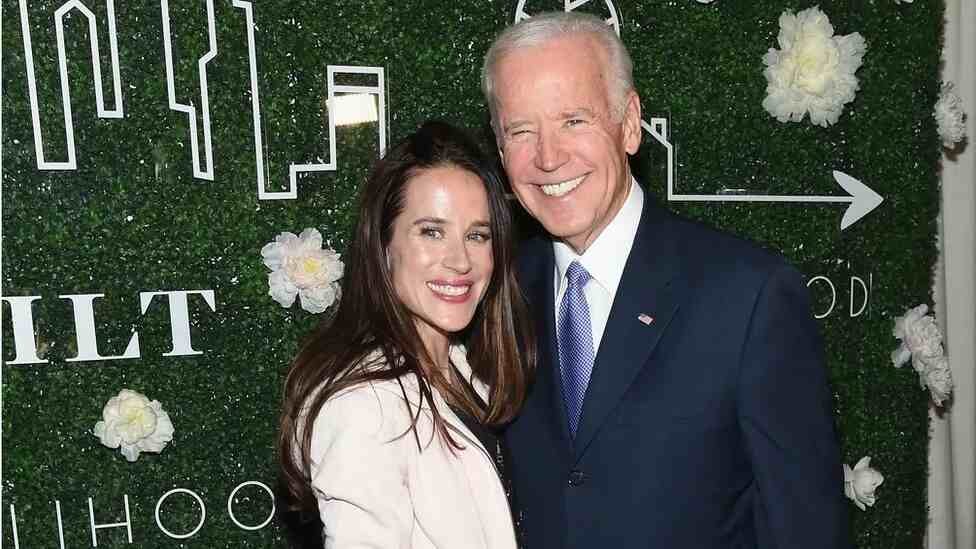 Ashley Biden poses for a photo with her father during the launch of her clothing line-up