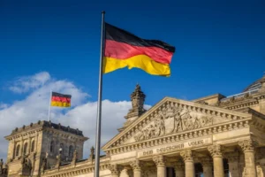 German Flag waives in front of the Reichstag