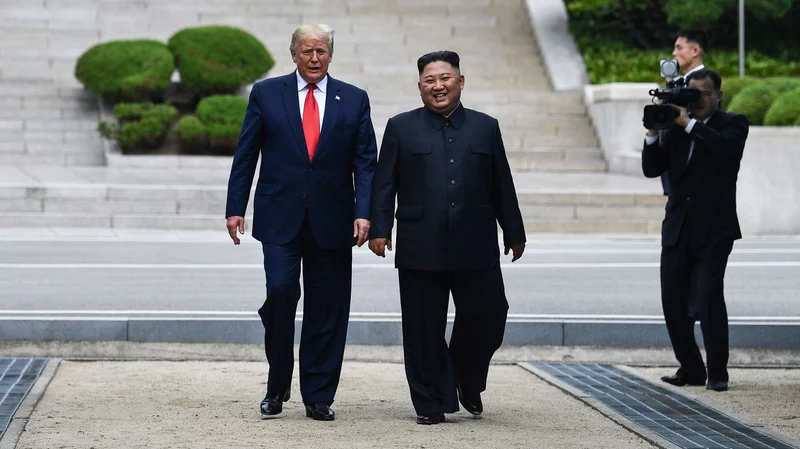 North Korean leader Kim Jong Un walks with President Trump north of the military DMZ line (Brendan Smialowski/AFP/Getty Images)